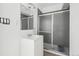 Bathroom featuring a vanity with sink, mirror, and a shower with sliding glass doors at 8073 Mt Lincoln Rd, Littleton, CO 80125