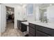 Lavish bathroom featuring dual vanities and a luxurious walk-in closet at 8073 Mt Lincoln Rd, Littleton, CO 80125