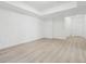 Spacious bonus room with hardwood floors, neutral paint, and an open layout, ideal for versatile use at 8073 Mt Lincoln Rd, Littleton, CO 80125
