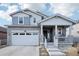 Charming two-story home with stone accents, inviting front porch, and a two-car garage at 8073 Mt Lincoln Rd, Littleton, CO 80125