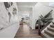 Inviting foyer with hardwood floors, a staircase, and an open view to the living room at 8073 Mt Lincoln Rd, Littleton, CO 80125
