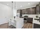 Stylish kitchen features a center island, stainless steel appliances, and sleek finishes at 8073 Mt Lincoln Rd, Littleton, CO 80125