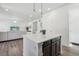 Spacious kitchen with center island, stainless steel appliances, and open layout to the living area at 8073 Mt Lincoln Rd, Littleton, CO 80125