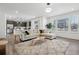 Bright living room features a large window, modern lighting, and an adjacent kitchen at 8073 Mt Lincoln Rd, Littleton, CO 80125