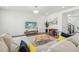 Cozy living room with a large sectional sofa, entertainment center, and stylish decor at 8073 Mt Lincoln Rd, Littleton, CO 80125