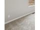 Bedroom detail featuring neutral carpet, window, trim, and electrical outlets at 2120 Christina St, Fort Lupton, CO 80621