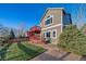 Backyard view from the side of a two story deck with steps down to the lawn at 9505 Painted Canyon Cir, Highlands Ranch, CO 80129