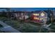 Backyard view with a two-level deck, well-kept lawn, and wooden fence, creating a cozy outdoor retreat at 9505 Painted Canyon Cir, Highlands Ranch, CO 80129