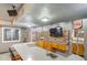 Basement bar includes stone accents, seating, and entertainment area at 9505 Painted Canyon Cir, Highlands Ranch, CO 80129