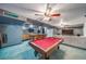 Finished basement has pool table, bar, and a comfortable living area at 9505 Painted Canyon Cir, Highlands Ranch, CO 80129