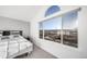 Bright bedroom with a large window showcasing the scenic views at 9505 Painted Canyon Cir, Highlands Ranch, CO 80129