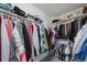 Spacious walk-in closet offers ample storage with organized shelving and hanging racks at 9505 Painted Canyon Cir, Highlands Ranch, CO 80129