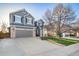 Traditional two-story home with a wide driveway and a basketball hoop for outdoor fun at 9505 Painted Canyon Cir, Highlands Ranch, CO 80129