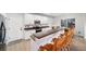 Well-lit kitchen features stainless steel appliances, ample cabinet space and wood breakfast bar at 9505 Painted Canyon Cir, Highlands Ranch, CO 80129