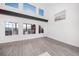 Bright living room with high ceilings and large windows providing ample natural light at 9505 Painted Canyon Cir, Highlands Ranch, CO 80129