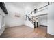 Spacious living room with a staircase, wood flooring, and an abundance of natural light at 9505 Painted Canyon Cir, Highlands Ranch, CO 80129