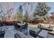 Backyard patio featuring outdoor seating, a dining table, and stylish outdoor rug at 14032 Park Cove Dr, Broomfield, CO 80023