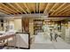 Unfinished basement with exposed wood ceiling beams and a concrete floor offers potential for customization at 14032 Park Cove Dr, Broomfield, CO 80023