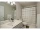 Clean bathroom with a shower-tub combo, marble countertop, and modern fixtures at 14032 Park Cove Dr, Broomfield, CO 80023