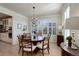 Elegant dining room with chandelier and shuttered windows at 14032 Park Cove Dr, Broomfield, CO 80023