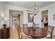 Formal dining room with hardwood floors and decorative chandelier at 14032 Park Cove Dr, Broomfield, CO 80023