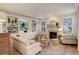 Inviting living room with a fireplace, built-in shelves, neutral color palette, and elegant decor at 14032 Park Cove Dr, Broomfield, CO 80023