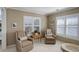 Bright and airy living room with neutral colors and lots of natural light from the windows at 14032 Park Cove Dr, Broomfield, CO 80023