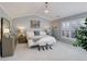 Bright main bedroom with vaulted ceiling, plantation shutters, and elegant chandelier at 14032 Park Cove Dr, Broomfield, CO 80023