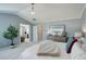 Light-filled main bedroom with light gray walls and an ensuite bathroom entrance at 14032 Park Cove Dr, Broomfield, CO 80023