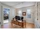 Sunny home office with hardwood floors, and custom built-in shelving at 14032 Park Cove Dr, Broomfield, CO 80023