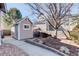 Backyard shed offering extra storage space with siding that matches the house at 14032 Park Cove Dr, Broomfield, CO 80023