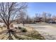 Scenic street view with mature trees, landscaping, and well-maintained homes in a quiet neighborhood at 14032 Park Cove Dr, Broomfield, CO 80023