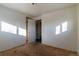 Bright bedroom with wood floors and a closet at 6661 Clermont St, Commerce City, CO 80022