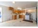 Small kitchen with wood cabinets and appliances at 6661 Clermont St, Commerce City, CO 80022