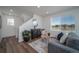 Living room with hardwood floors and cozy sitting area at 13496 E 103Rd Ave, Commerce City, CO 80022