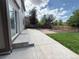 A well kept backyard, with concrete patio, fence, grass, and nice landscaping at 20401 E Chenango Pl, Aurora, CO 80015