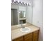 Bathroom vanity featuring a sink, mirror and lights at 20401 E Chenango Pl, Aurora, CO 80015