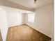 A simple bedroom with neutral carpet and white walls at 20401 E Chenango Pl, Aurora, CO 80015