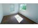 Bright bedroom featuring neutral carpet, white walls and sunny windows at 20401 E Chenango Pl, Aurora, CO 80015