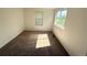 Bright bedroom featuring neutral carpet, white walls and sunny windows at 20401 E Chenango Pl, Aurora, CO 80015