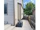 A side view of a two-story house with neutral siding and a well-maintained exterior at 20401 E Chenango Pl, Aurora, CO 80015