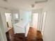 Second-floor hallway with wooden floors and natural light at 20401 E Chenango Pl, Aurora, CO 80015