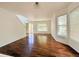 Bright living room with hardwood floors, large windows, and stylish lighting, creating a welcoming atmosphere at 20401 E Chenango Pl, Aurora, CO 80015