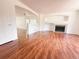 Open-concept living space with hardwood floors, a fireplace, and seamless flow, ideal for modern living at 20401 E Chenango Pl, Aurora, CO 80015