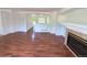 Bright living room featuring laminate flooring and a fireplace at 20401 E Chenango Pl, Aurora, CO 80015
