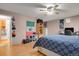Spacious bedroom features wood floors, ceiling fan, with an adjoined bathroom at 9135 Bellaire St, Thornton, CO 80229