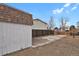 Shed and parking area in backyard with partial privacy fence at 9135 Bellaire St, Thornton, CO 80229