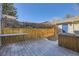 Small fenced backyard and patio area on a sunny day at 624 S Depew St # C, Lakewood, CO 80226