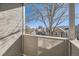 Balcony view of nearby houses with an overhanging tree providing shade at 624 S Depew St # C, Lakewood, CO 80226