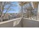 Balcony view of a neighboring home framed by an overhanging tree at 624 S Depew St # C, Lakewood, CO 80226